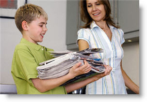 boy carrying newspapers